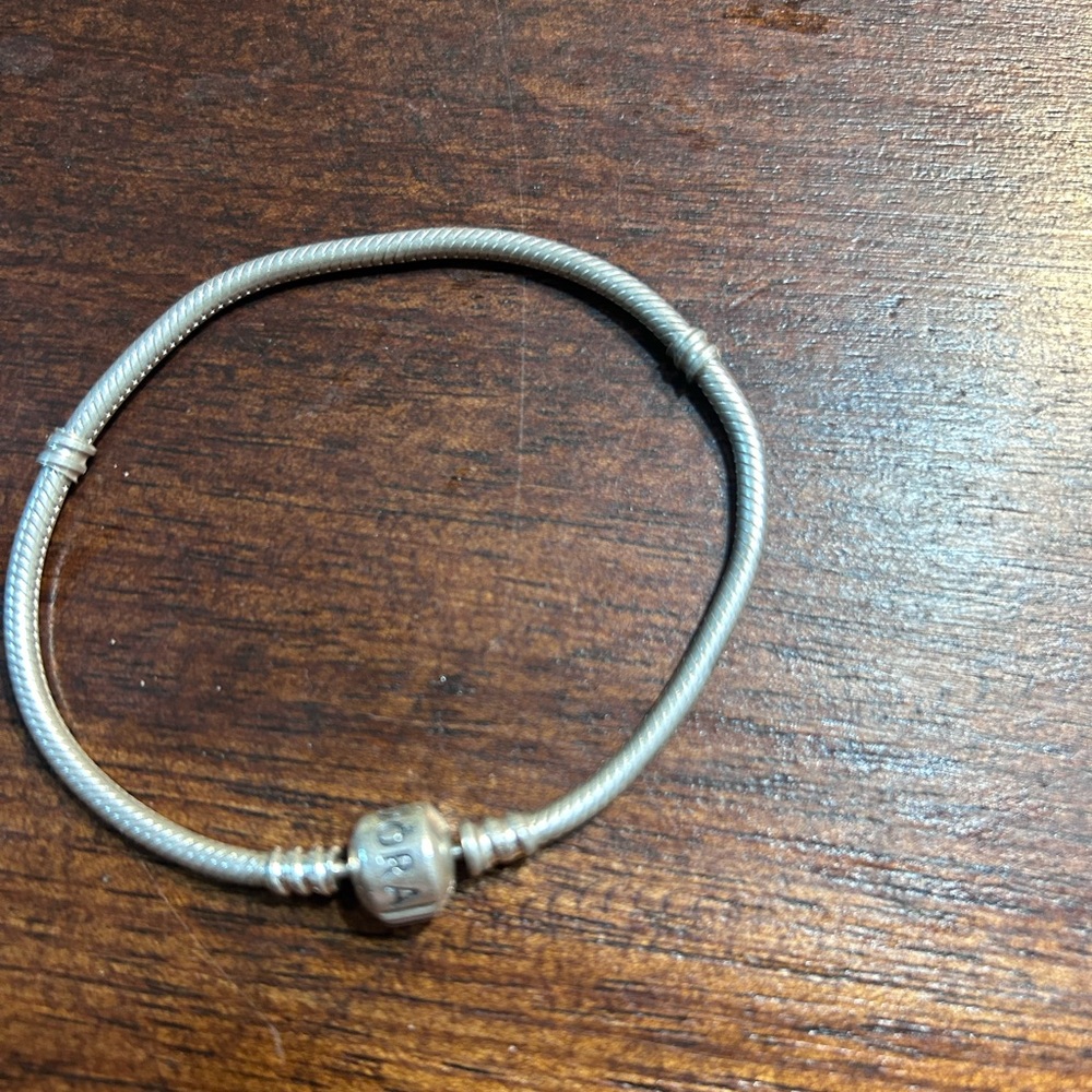 Pandora authentic bracelet with security chain.